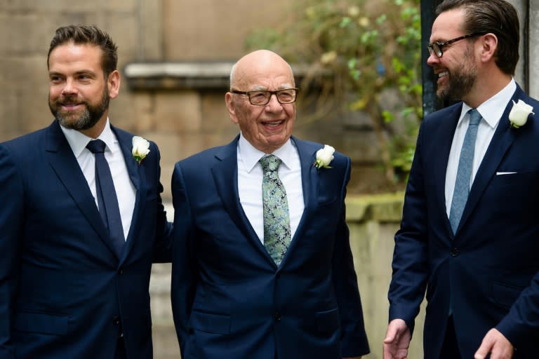 Rupert Murdoch (C) with his sons Lachlan (L) and James (R)