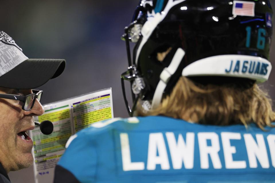 Jacksonville Jaguars head coach Doug Pederson talks with Trevor Lawrence (16) during the third quarter of a regular season NFL football matchup Sunday, Dec. 17, 2023 at EverBank Stadium in Jacksonville, Fla. The Baltimore Ravens defeated the Jacksonville Jaguars 23-7. [Corey Perrine/Florida Times-Union]