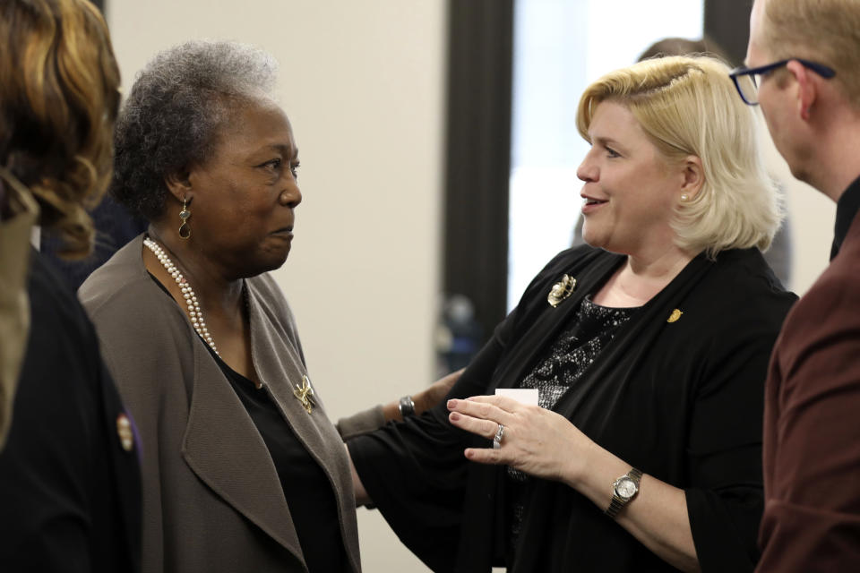 Emanuel AME shooting survivor Polly Sheppard, left, and state Sen. Penry Gustafson, R-Camden, right, speak after a South Carolina Senate subcommittee hearing on a hate crimes bill, Tuesday, March 28, 2023, in Columbia, S.C. (AP Photo/Jeffrey Collins)