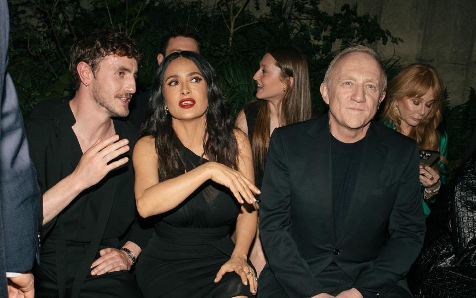 Pinault, pictured next to Salma Hayek, his wife, at the Gucci Cruise show