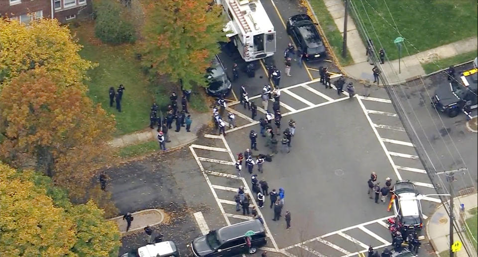 In this image provided by WABC-TV, police respond to a report of officers shot Tuesday, Nov. 1, 2022, in Newark, N.J. Details on the number of officers injured or the extent of their injuries weren’t immediately available. (WABC-TV via AP)