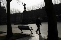 A man walks along the empty main square of Dunkirk during the new lockdown,in northern France, Saturday, Feb. 27, 2021. Dunkirk and the surrounding coastal area will be under weekend lockdowns for at least two weeks, in addition to a national 6 p.m. to 6 a.m. curfew, imposed to curb soaring COVID-19 infections. (AP Photo/Michel Spingler)