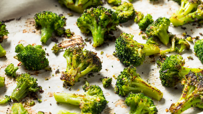 roasted green broccoli on baking sheet