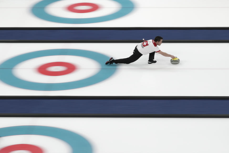 <p>Switzerland’s Martin Rios throws a stone during a during a mixed doubles curling match against United States at the 2018 Winter Olympics in Gangneung, South Korea. (AP Photo/Felipe Dana) </p>