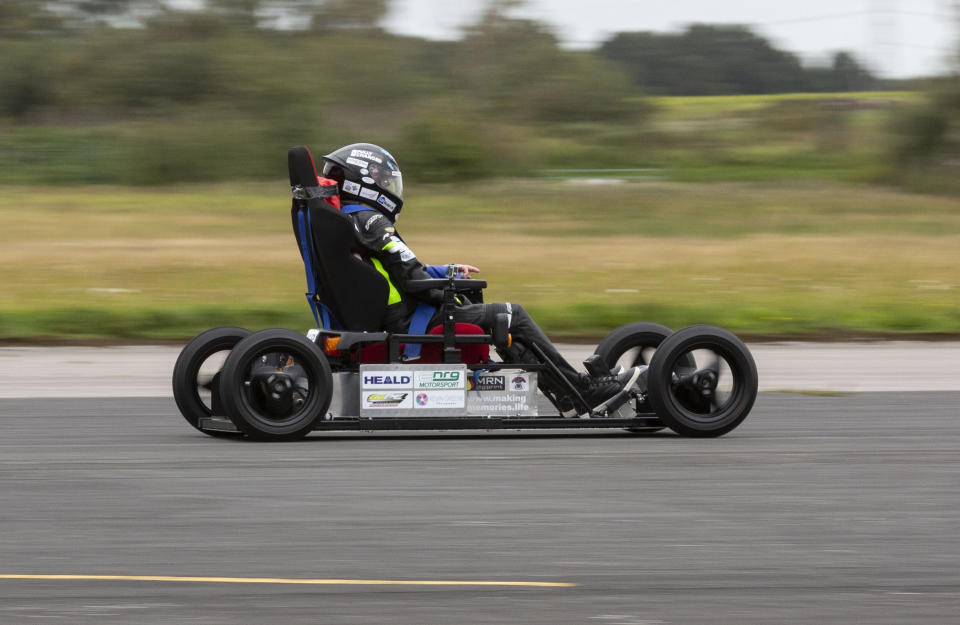 Wacky design engineer sets new Guinness World Record after reaching speeds of over 40mph - in a WHEELIE BIN