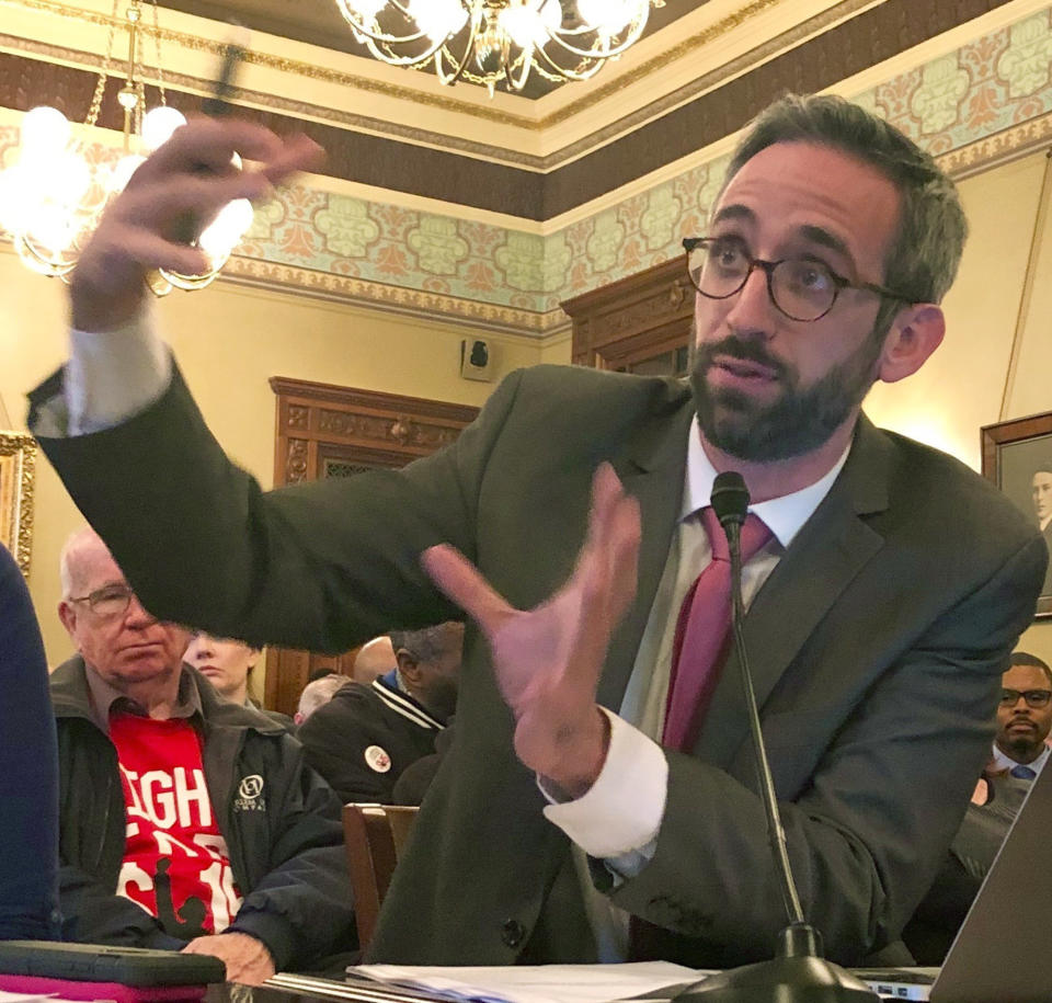 Illinois state Rep. Will Guzzardi, D-Chicago, testifies before the Labor and Commerce Committee Wednesday, Feb. 13, 2019 on his proposal to increase the minimum wage to $15 by 2025. (AP Photo/John O'Connor )