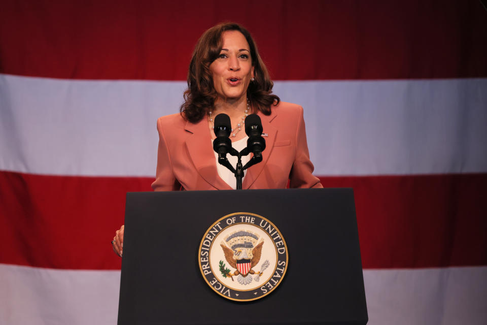 Vice President Kamala Harris at a podium marked Vice President of the United States.