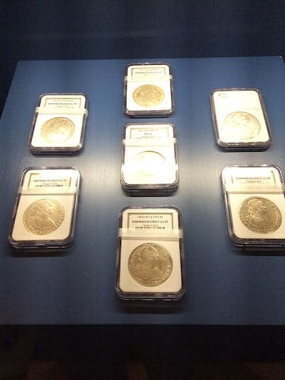 Spanish silver and gold coins from the reign of Charles IV, extracted by Odyssey from the wreck of the frigate Mercedes and prepared for sale by said company as well. <a href="https://commons.wikimedia.org/wiki/File:Fragata_Mercedes_Exposicion_AGI_02_monedas_Odyssey.JPG" rel="nofollow noopener" target="_blank" data-ylk="slk:Hispalois/Wikimedia Commons;elm:context_link;itc:0;sec:content-canvas" class="link ">Hispalois/Wikimedia Commons</a>, <a href="http://creativecommons.org/licenses/by-sa/4.0/" rel="nofollow noopener" target="_blank" data-ylk="slk:CC BY-SA;elm:context_link;itc:0;sec:content-canvas" class="link ">CC BY-SA</a>