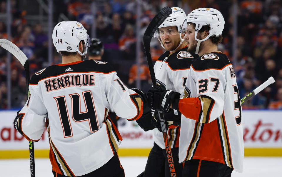 Anaheim Ducks defenseman Cam Fowlerd, center, celebrates after his goal with teammates during first-period NHL hockey game action against the Edmonton Oilers in Edmonton, Alberta, Saturday, Dec. 17, 2022. (Jeff McIntosh/The Canadian Press via AP)