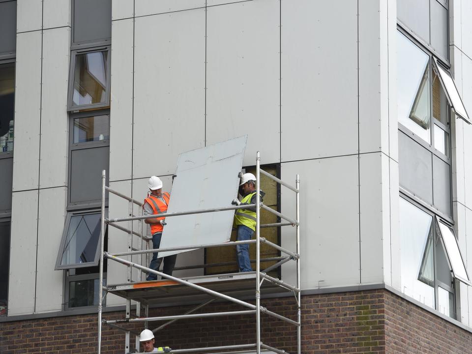 A portion of cladding is removed from a block in Camden: Jeremy Selwyn