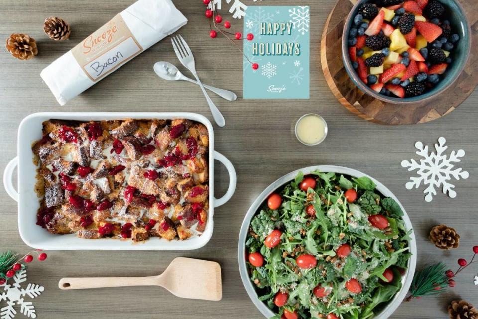 Each holiday kit at Snooze comes with salad, fruit and a side of bacon.