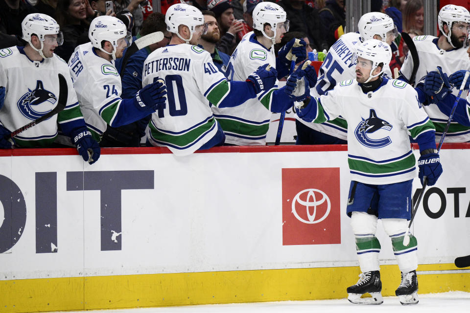 Vancouver Canucks right wing Conor Garland (8) celebrates his goal during the first period of an NHL hockey game against the Washington Capitals, Sunday, Feb. 11, 2024, in Washington. (AP Photo/Nick Wass)