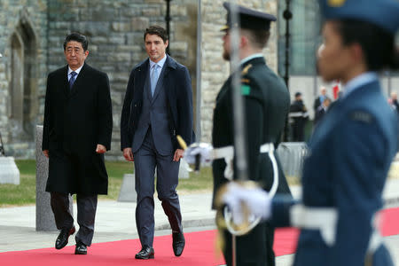 Canada's Prime Minister Justin Trudeau and Japan's Prime Minister Shinzo Abe take part in a welcoming ceremony on Parliament Hill in Ottawa, Ontario, Canada, April 28, 2019. REUTERS/Chris Wattie