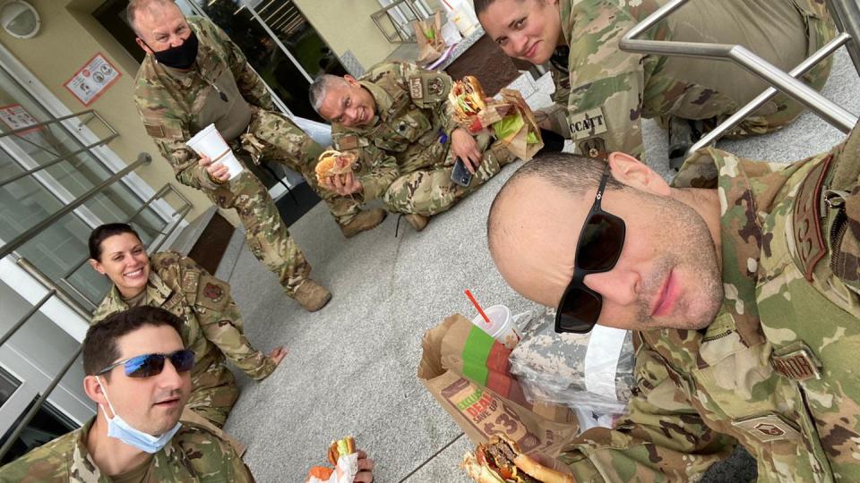 Capt. Katie Lunning and other Air Force medical personnel eat Burger King meals at Landstuhl Regional Medical Center, Germany, following the aeromedical evacuation of victims of the suicide bombing at Kabul's airport on Aug. 26, 2021. (Courtesy of Katie Lunning)