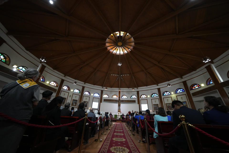 From left, Bishops' Conference of Central Asia President José Luis Mumbiela Sierra, Pope Francis, Pontifical Ceremonier Archbishop Diego Giovanni Ravelli, and Prefect of Ulaanbaatar Cardinal Giorgio Marengo sit inside the Saints Peter and Paul Catholic Cathedral in Ulaanbaatar, Saturday, Sept. 2, 2023, for a meeting with the local clergy. Pope Francis has praised Mongolia's tradition of religious freedom dating to the times of its founder, Genghis Khan, as he opened the first-ever papal visit to the Asian nation with a plea for peace and an end to the "insidious threat of corruption." (AP Photo/Andrew Medichini)