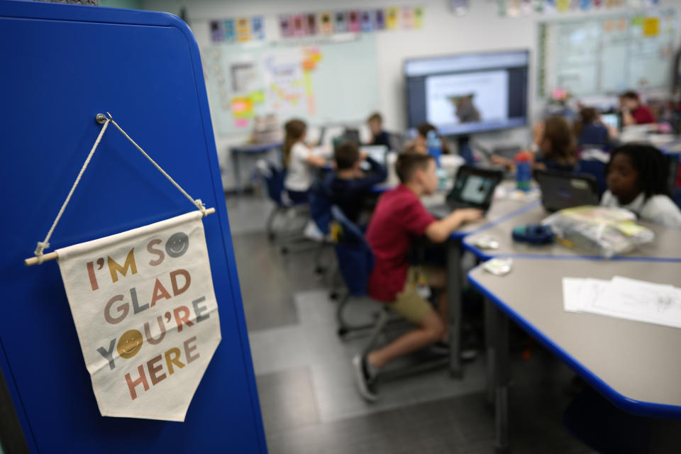 A sign hangs inside the classroom of third grade teacher Megan Foster at A.D. Henderson School in Boca Raton, Fla., Tuesday, April 16, 2024. When teachers at the K-8 public school, one of the top-performing schools in Florida, are asked how they succeed, one answer is universal: They have autonomy. (AP Photo/Rebecca Blackwell)