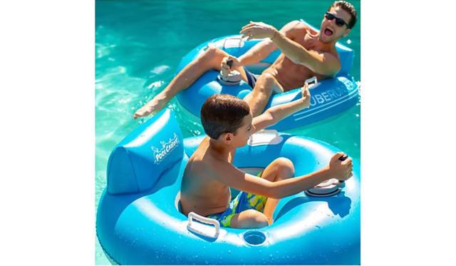 Man and young boy on two motorized pool floats controlled by joystick