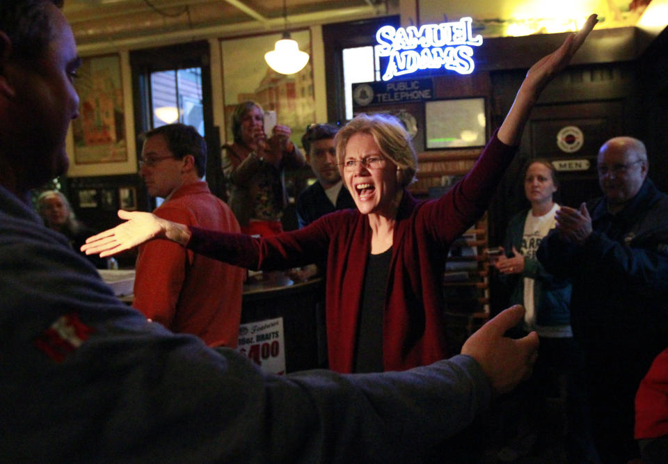 Democratic candidate for the U.S. Senate Elizabeth Warren greets people during a campaign stop at Doyle's Cafe, in Boston, Tuesday, Oct. 23, 2012. (AP Photo/Steven Senne)