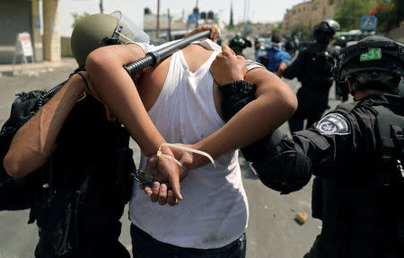 Israeli security forces arrest a Palestinian man following clashes outside Jerusalem's Old city July 21, 2017. REUTERS/Ammar Awad