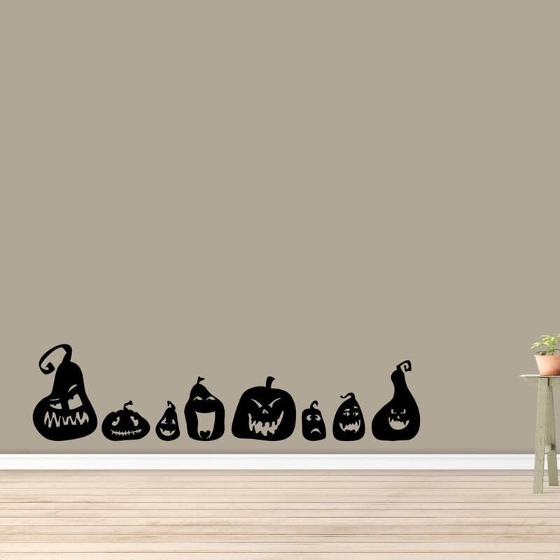 The pumpkin wall decal placed on a living room wall