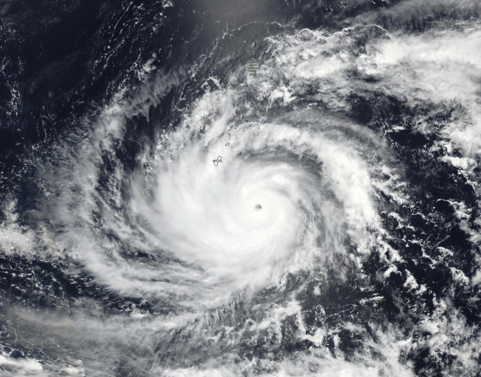 This Tuesday, May 23, 2023 satellite image released by NASA shows Typhoon Mawar, a powerful storm that could deliver the biggest hit in two decades to the U.S. territory in the Pacific, approaching Guam. (NASA via AP)