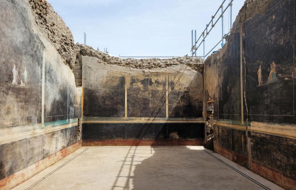 The dining room’s black walls, where the paintings were uncovered, were coated in black paint to avoid oil lamps being visible, a Pompeii archaeologist said. via REUTERS