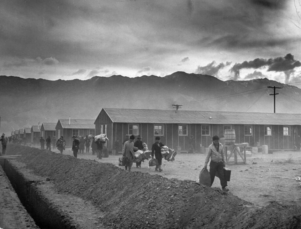 The first group of 82 Japanese-Americans arrives at the Manzanar internment camp, March 1942