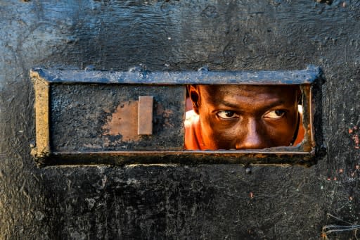 A man looks inside the Orphanage of the Church of Bible Understanding on February 14, 2020, where a fire broke out the previous night in the Kenscoff area outside of Port-au-Prince