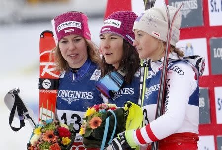 Alpine Skiing - FIS Alpine Skiing World Championships - Women's Alpine Combined - St. Moritz, Switzerland - 10/2/17 - Wendy Holdener of Switzerland is flanked by silver medalist Michelle Gisin of Switzerland (L) and bronze medalist Michaela Kirchgasser of Austria after winning the gold medal in the Alpine Combined. REUTERS/Denis Balibouse