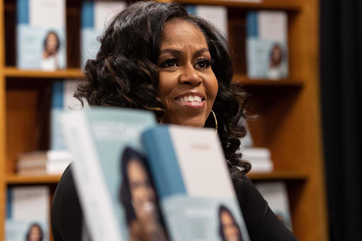 Michelle Obama meets with fans during a book signing on the first anniversary of the launch of her memoir Becoming at the Politics and Prose bookstore in Washington, DC, on 18 November, 2019: NICHOLAS KAMM/AFP via Getty Images