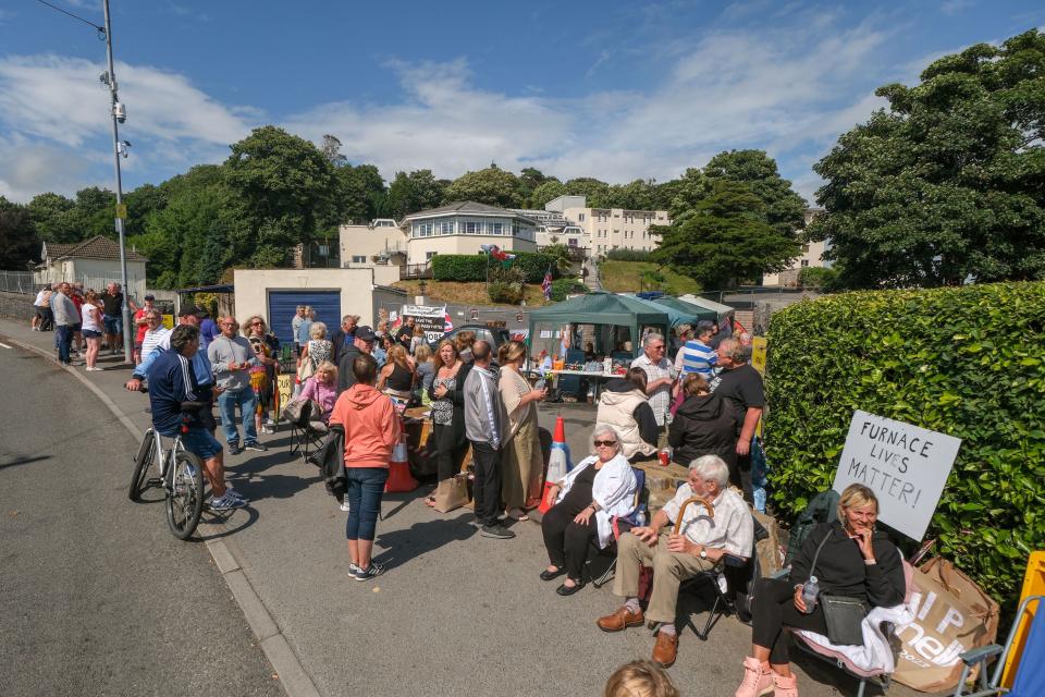 Local residents protesting against the Home Office's decision to place 200+ asylum seekers in the 4* Stradey Park Hotel. (Shutterstock 14003235n)