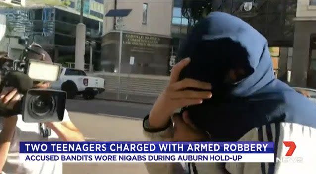 One of the teens covered his face with a hooded top. Source: 7 News