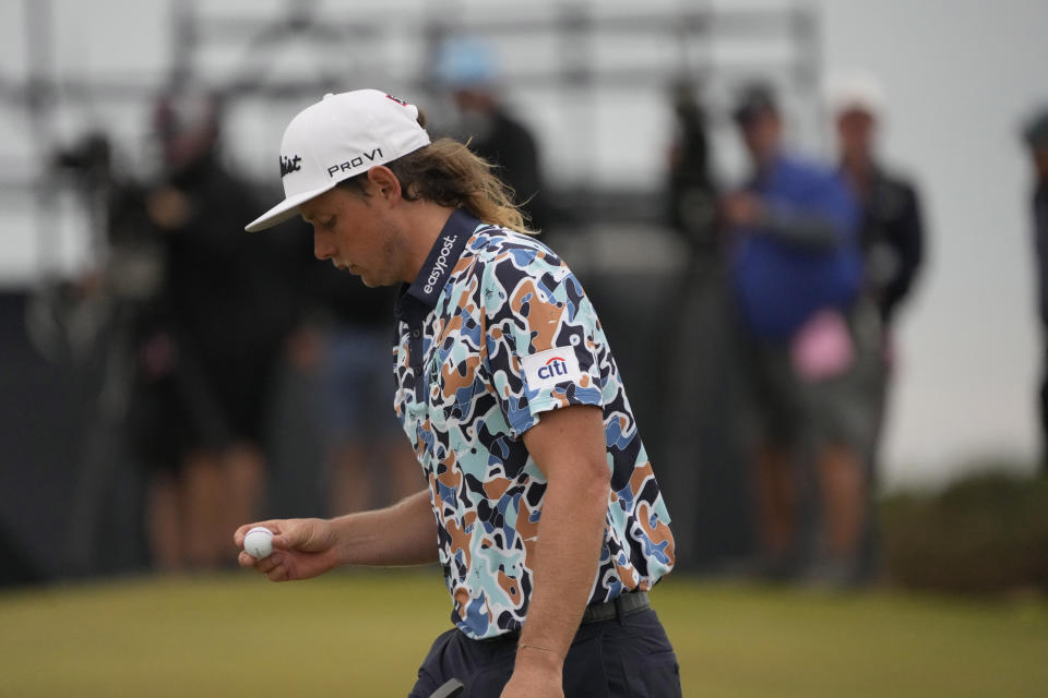 Cameron Smith, of Australia, looks at his ball after putting on the 15th hole during the third round of the British Open golf championship on the Old Course at St. Andrews, Scotland, Saturday July 16, 2022. (AP Photo/Gerald Herbert)