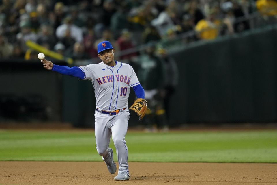 New York Mets third baseman Eduardo Escobar throws to first for the out on Oakland Athletics' Brent Rooker during the fourth inning of a baseball game in Oakland, Calif., Friday, April 14, 2023. (AP Photo/Godofredo A. Vásquez)