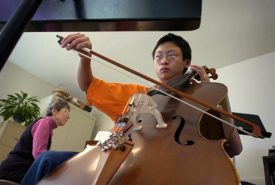 Wendy Ardizzone of the Joy of Music Program provides piano accompaniment to Wilfred Hsei of Northboro in 2006.