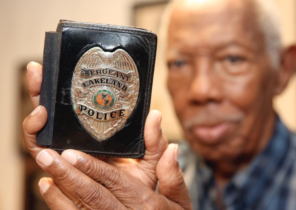 Edgar Pickett, a retired Lakeland Police Department detective, displays his badge at his home in 2015. Pickett died last week at age 95.