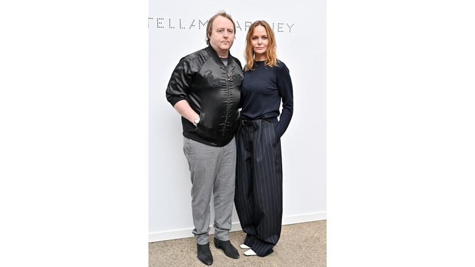 Stella McCartney standing with brother James McCartney 