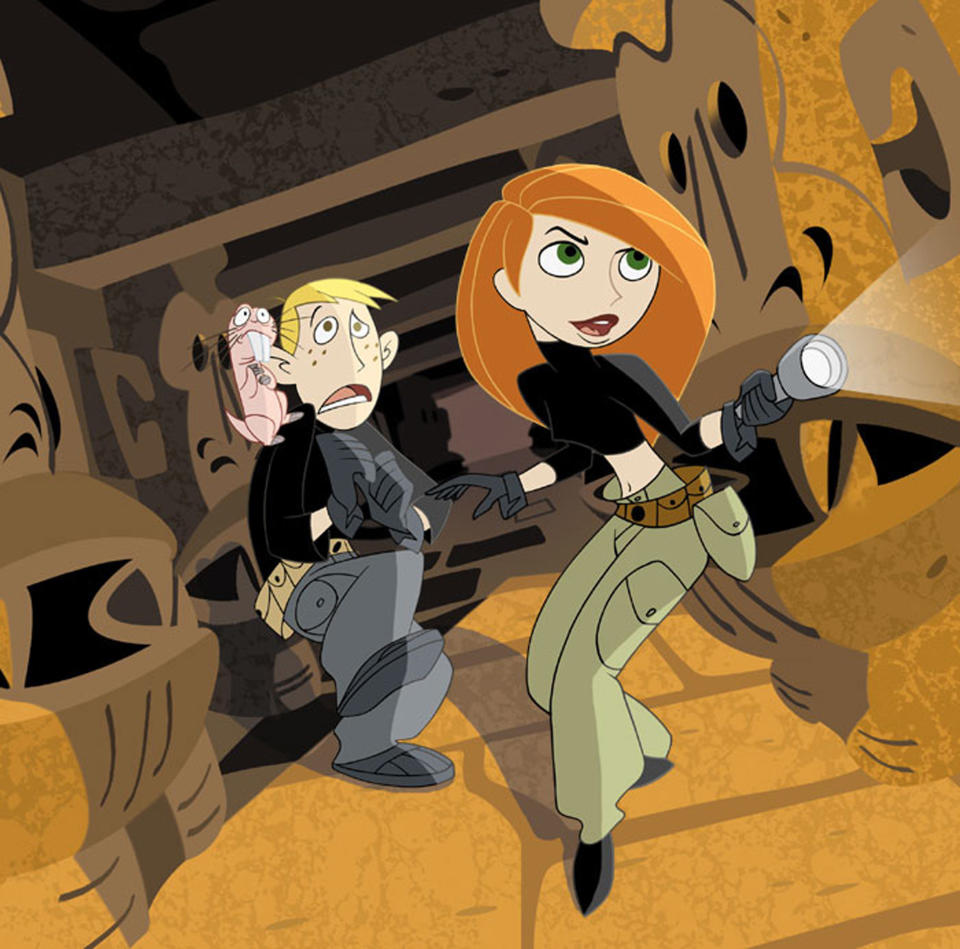 Kim Possible and Ron Stoppable walk down a hallway