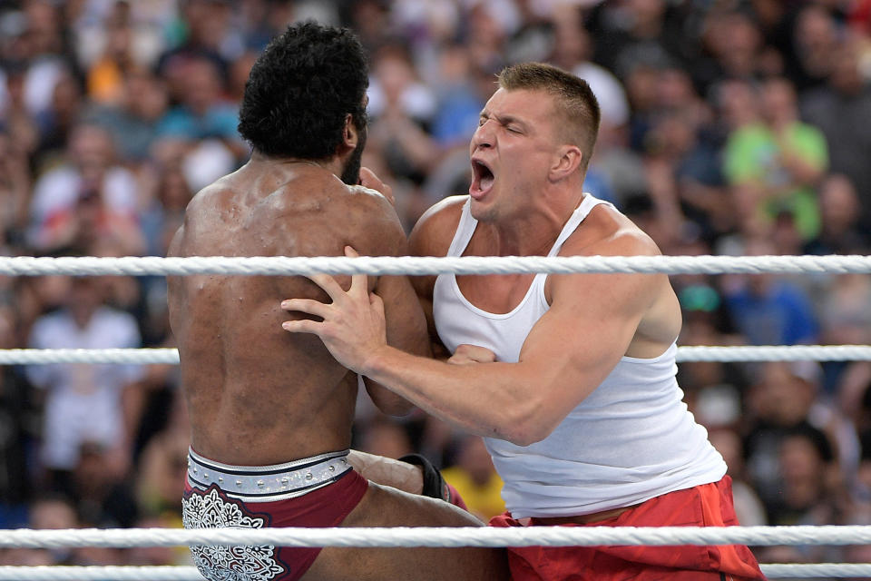 IMAGE DISTRIBUTED FOR WWE - New England Patriots tight end Rob Gronkowski delivers a body tackle to WWE Superstar Jinder Mahal during a match at WrestleMania 33 on Sunday, April 2, 2017, in Orlando, Fla. (Phelan M. Ebenhack/AP Images for WWE)