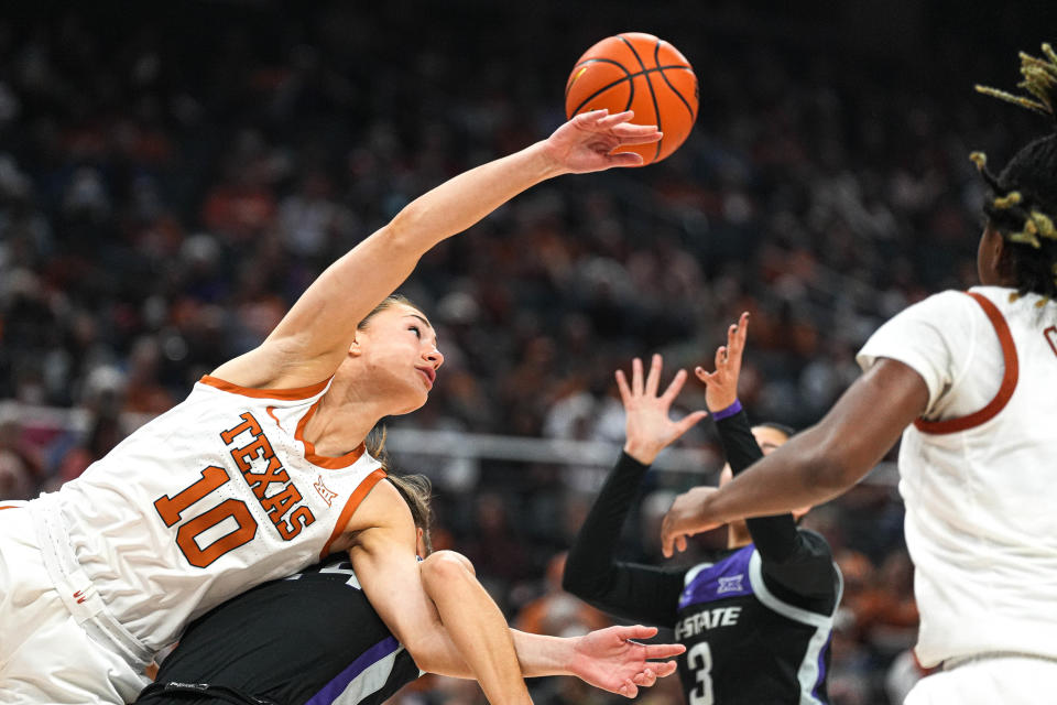 Texas guard Shay Holle dives for a rebound against Kansas State guard Emilee Ebert during their game at Moody Center on Dec. 31. The Longhorns, now 2-1 in Big 12 play, host No. 15 Kansas on Tuesday.