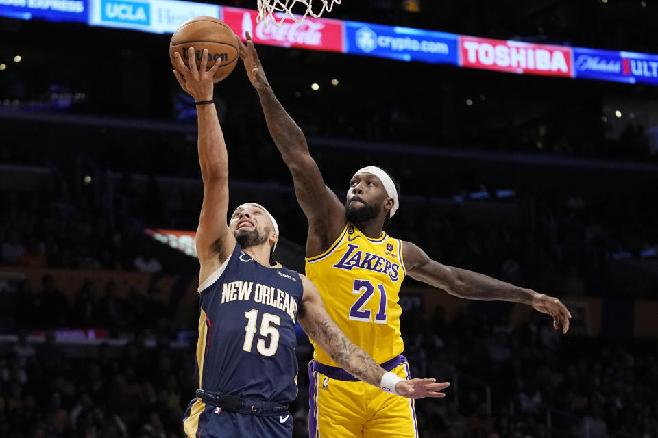 New Orleans Pelicans guard Jose Alvarado, left, shoots as Los Angeles Lakers guard Patrick Beverley defends during the first half of an NBA basketball game Wednesday, Nov. 2, 2022, in Los Angeles. (AP Photo/Mark J. Terrill)