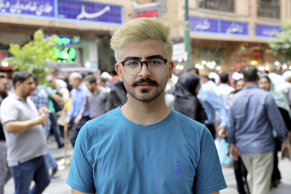 Sajjad Nazary, a 23-year-old university student, is interviewed by The Associated Press at the old main bazaar in Tehran, Iran, Tuesday, July 2, 2019. “Instead of the nuclear program, the Iranian people need bread,” Nazary told the AP outside of Tehran’s sprawling bazaar. “They want their economic situation to get better. The point is with nuclear energy, you can’t make your children’s bellies feel full.” (AP Photo/Ebrahim Noroozi)