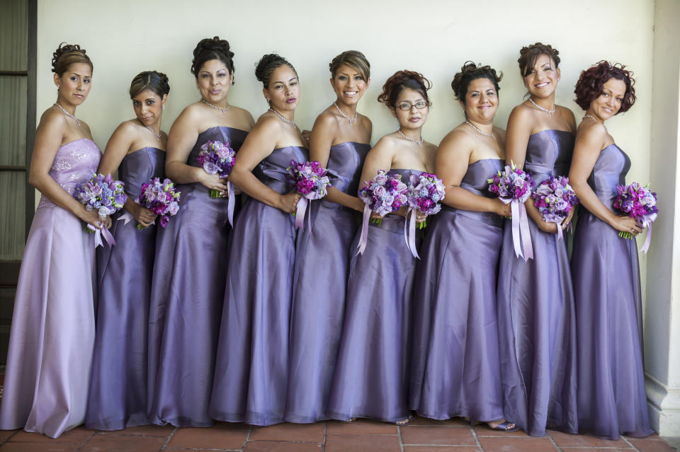 Bridesmaids and another woman in a lighter dress, same shape