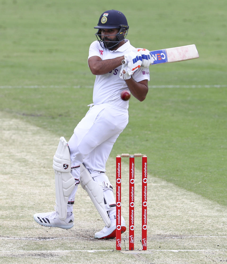 India's Rohit Sharma bats during play on day two of the fourth cricket test between India and Australia at the Gabba, Brisbane, Australia, Saturday, Jan. 16, 2021. (AP Photo/Tertius Pickard)