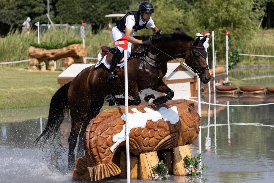 <p>India's Fouaad Mirza riding Seigneur competes in the equestrian's eventing team and individual cross country during the Tokyo 2020 Olympic Games at the Sea Forest Cross Country Course in Tokyo on August 1, 2021. (Photo by Yuki IWAMURA / AFP) (Photo by YUKI IWAMURA/AFP via Getty Images)</p> 