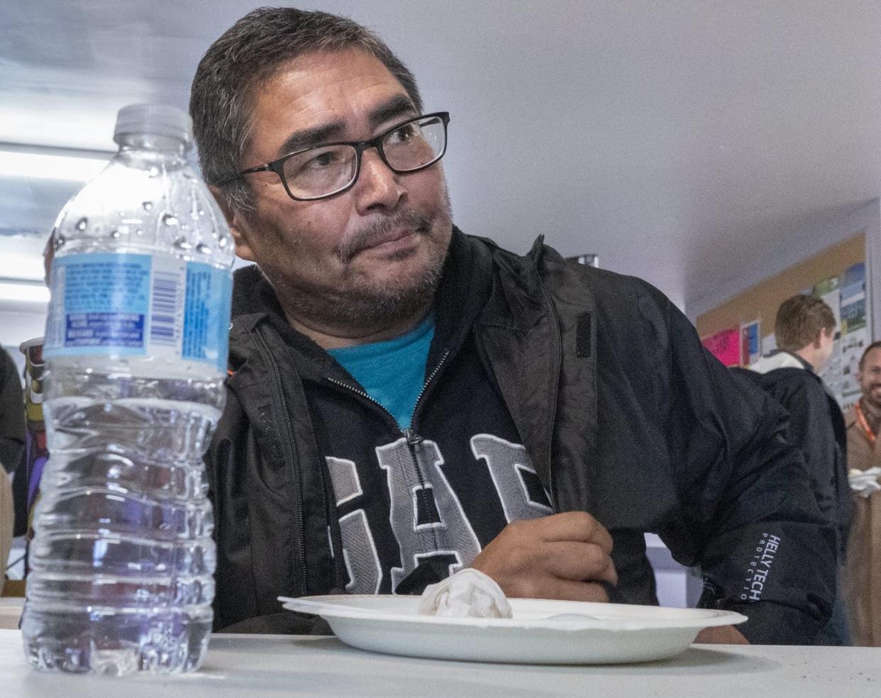 <span class="caption">A water bottle sits on the table in front of Chief and NDP candidate Rudy Turtle during a visit by NDP Leader Jagmeet Singh on Oct. 5, 2019 on the Grassy Narrows First Nation, where industrial mercury poisoning in its water system has seriously affected the health of the community.</span> <span class="attribution"><span class="source">THE CANADIAN PRESS/Paul Chiasson</span></span>