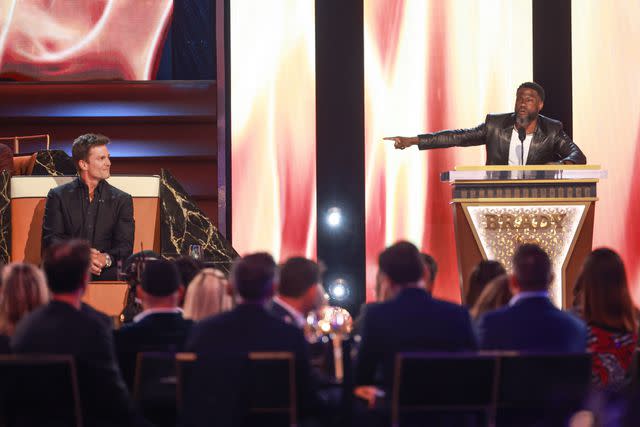 <p>Matt Winkelmeyer/Getty</p> (L-R) Tom Brady and Kevin Hart speak onstage during the Netflix special