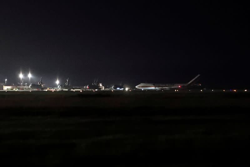 A cargo aircraft with American passengers from cruise ship Diamond Princess arrives at Travis Air Force Base in Fairfield, California