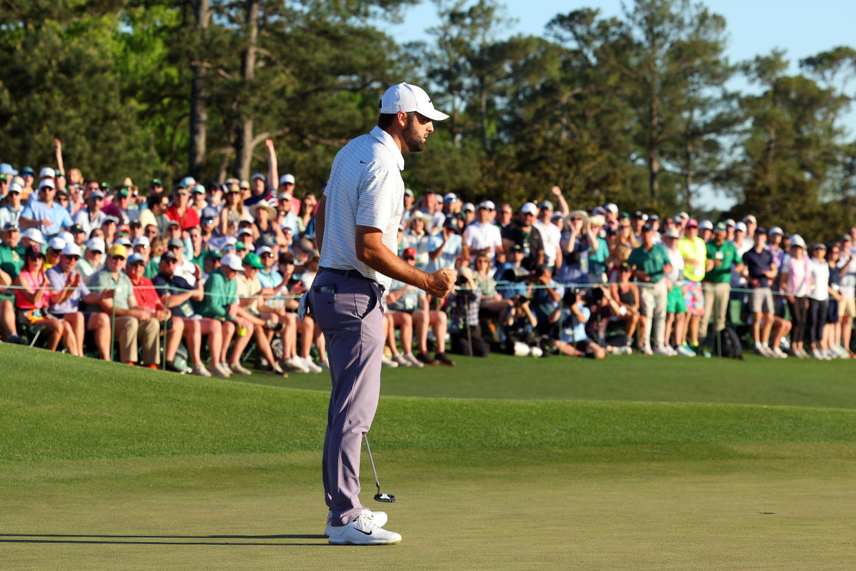 AUGUSTA, GEORGIA - APRIL 13: Scottie Scheffler of the United States reacts after making birdie on the 18th green during the third round of the 2024 Masters Tournament at Augusta National Golf Club on April 13, 2024 in Augusta, Georgia. (Photo by Andrew Redington/Getty Images)