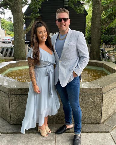 <p>Samantha McAfee Instagram</p> Pat McAfee and Samantha McAfee pose together for a photo while outdoors.